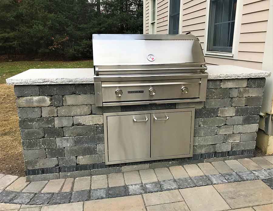 Amazing outside custom built grill in back yard.