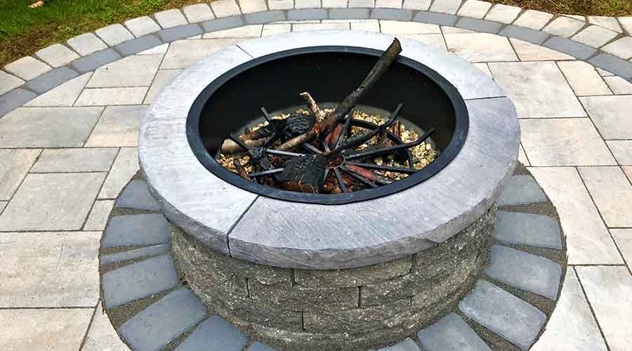 Stunning circular outdoor fire pit and patio.