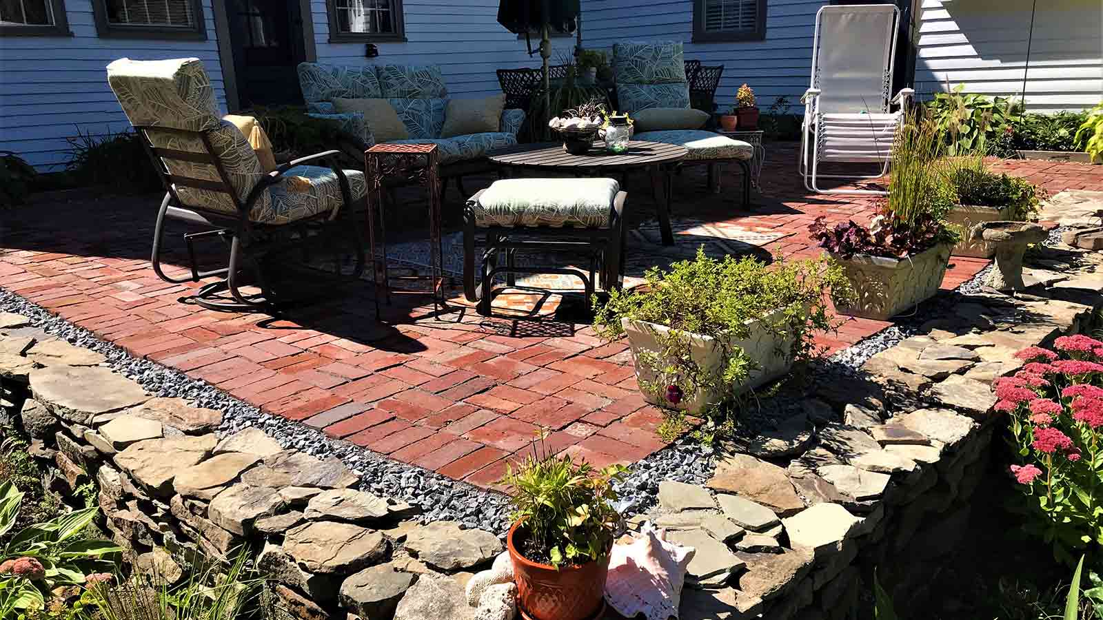 Custom brick patio with stone border.