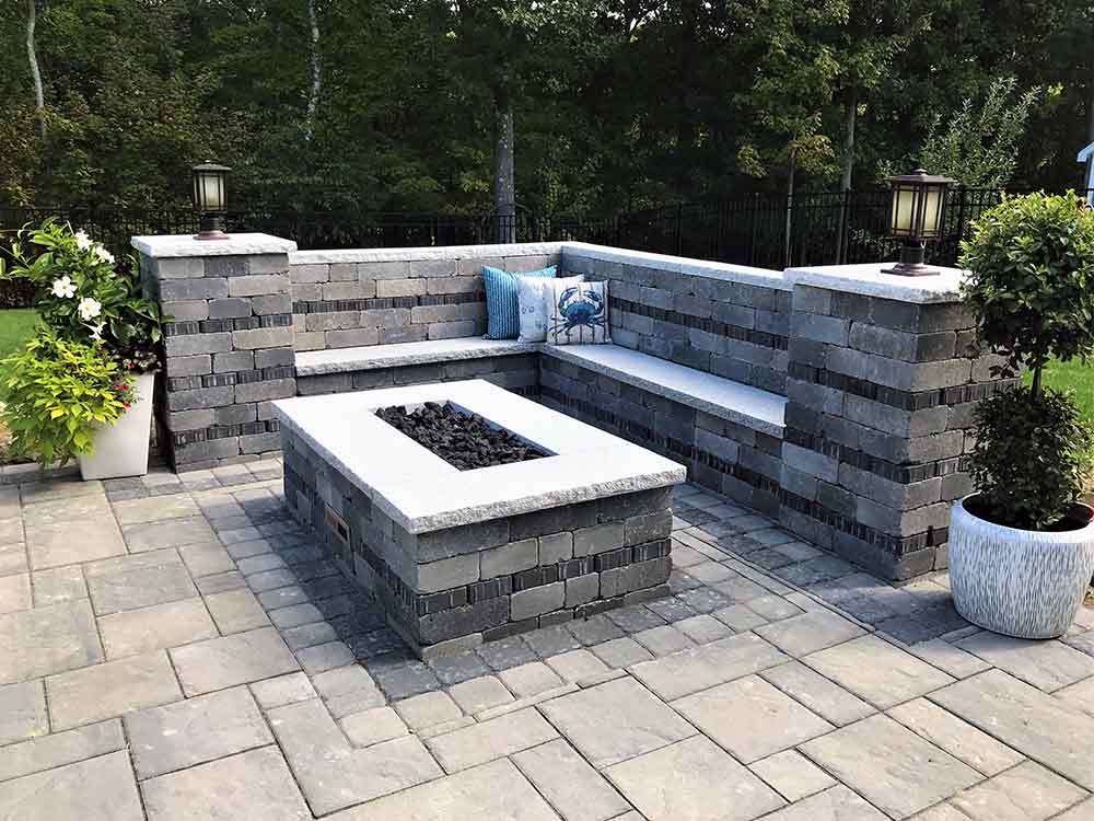 Custom outdoor fire pit and patio with columns.