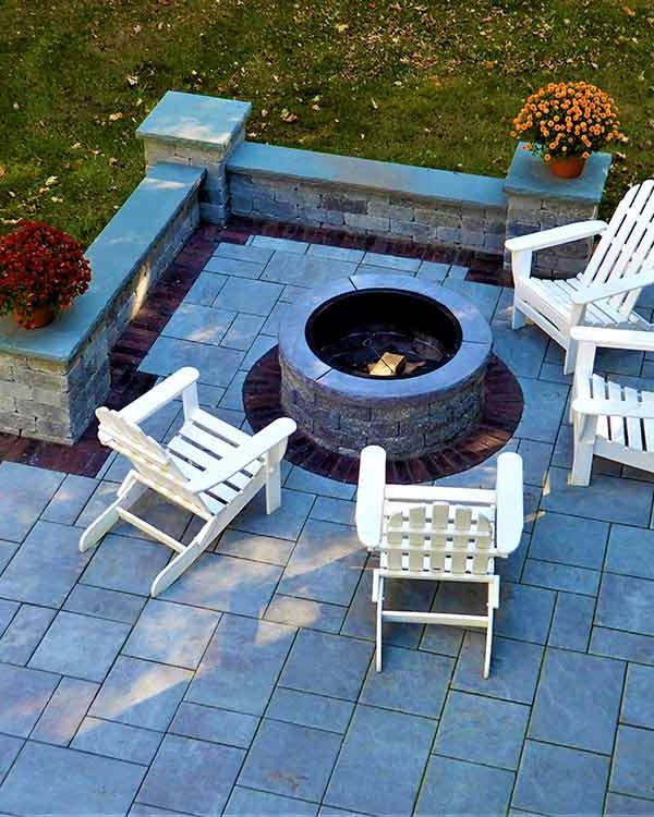 Patio with fire pit and wall.