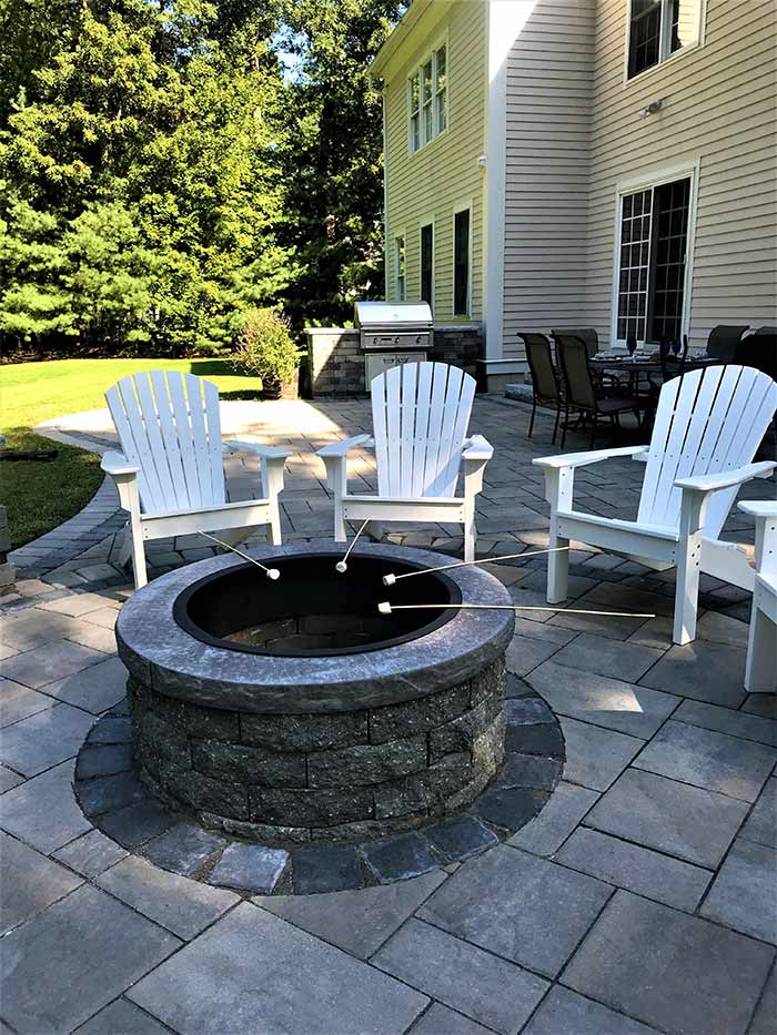 outdoor fire pit with adirondack chairs for back yard entertaining