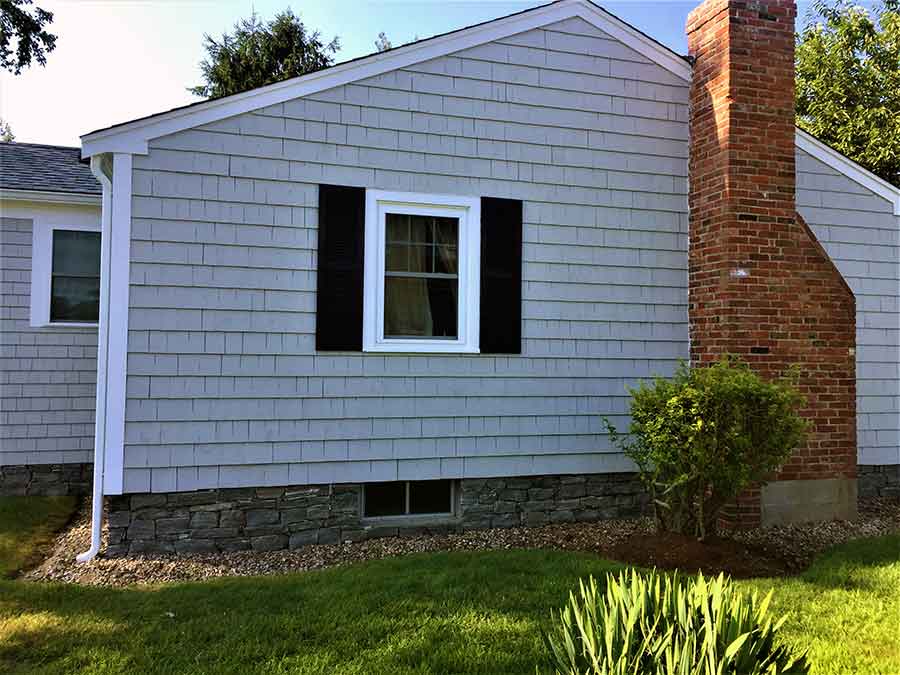 Veneer stone siding on home foundation.