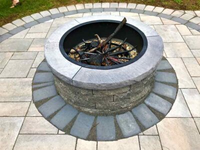 back yard outdoor fire pit and paver patio for entertaining