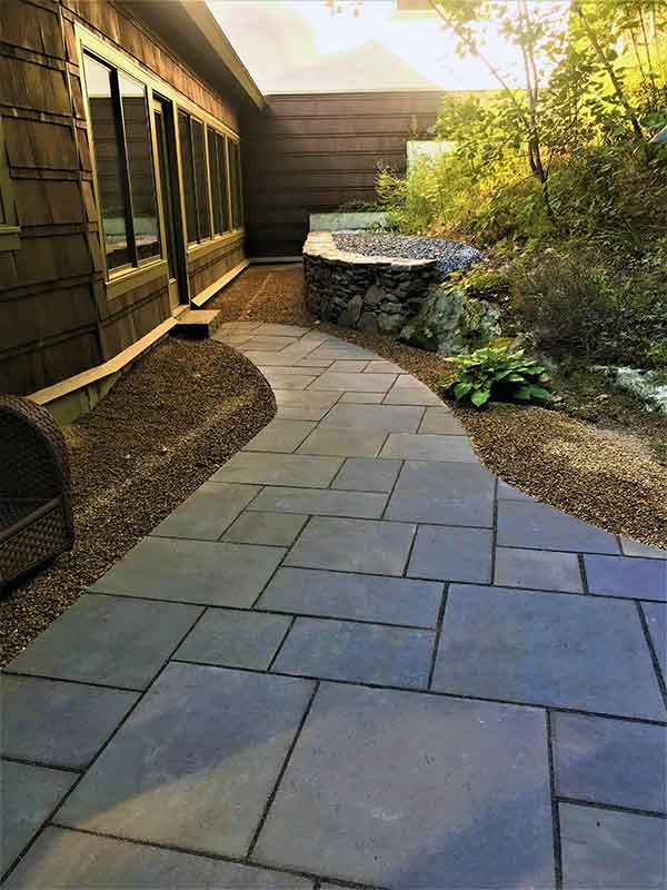 back yard natural stone walkway and fieldstone retaining wall