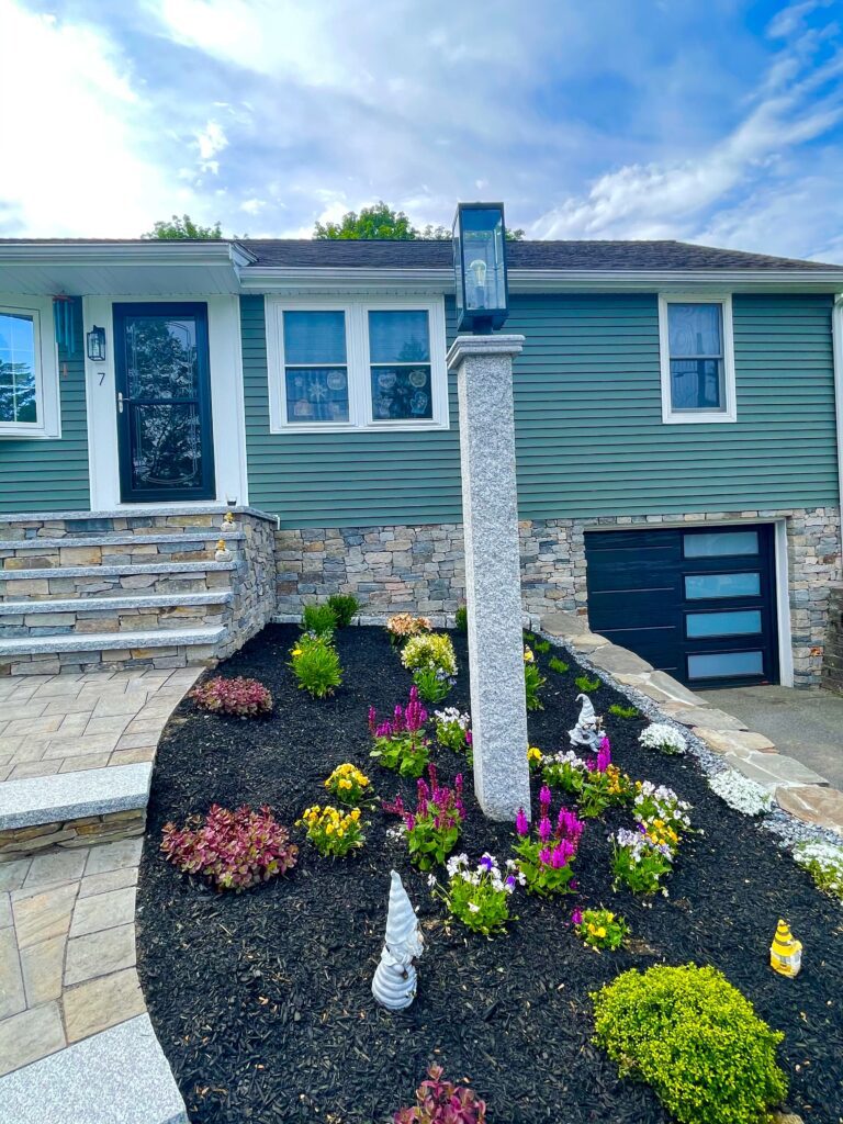 front home lamp post paver walkway with granite and veneer stone foundation