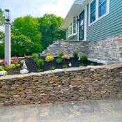 home foundation veneer stone with steps and wall granite lamp post