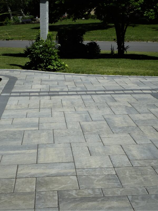 home side yard paver walkway and garage apron with black onyx border