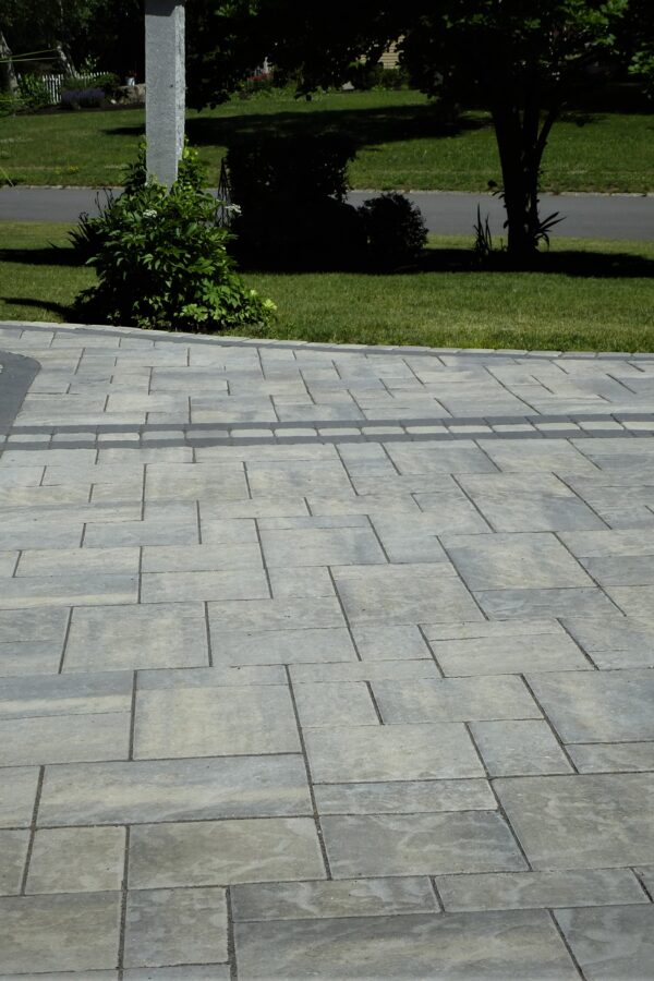 home side yard paver walkway and garage apron with black onyx border
