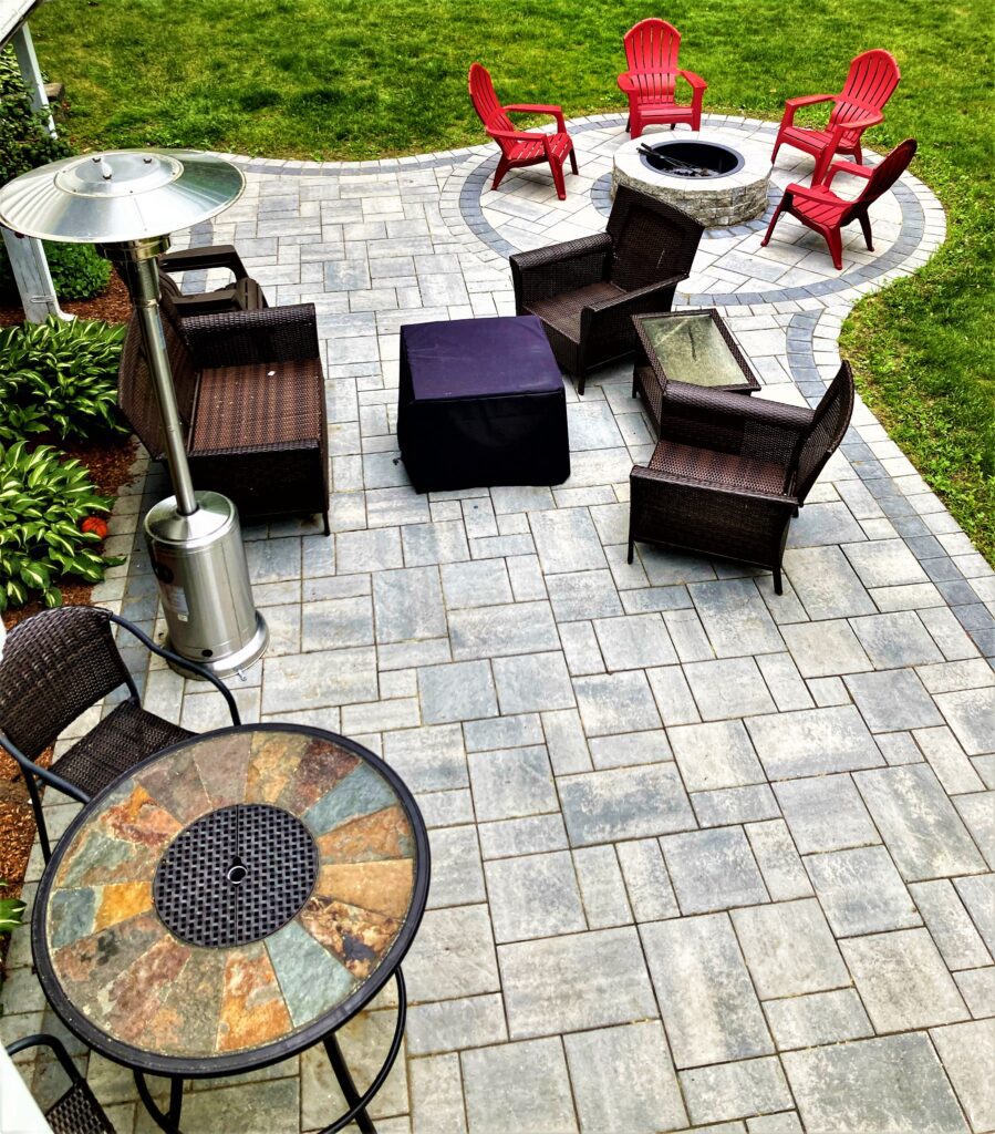 outdoor entertaining paver patio with fire pit and furniture