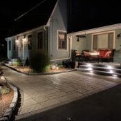 front paver walkway with lighting and veneer stone steps