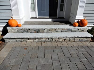 front walkway entrance with veneer stone steps and granite treads