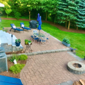 back yard entertaining area with paver patio and fire pit