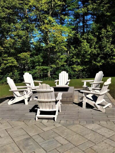 backyard paver patio with square fire pit