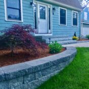 paver retaining wall for planting beds with granite steps