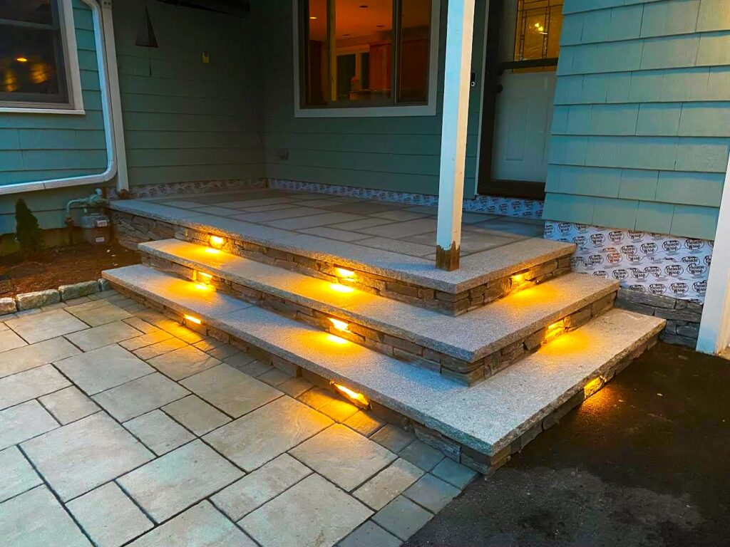 granite steps and paver walkway with lighting