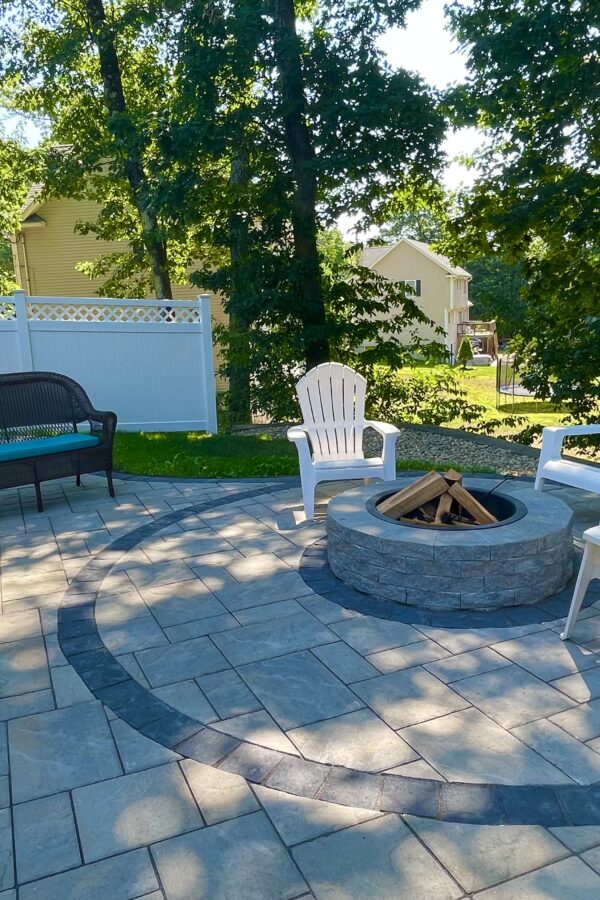 backyard outdoor entertaining space with patio and fire pit
