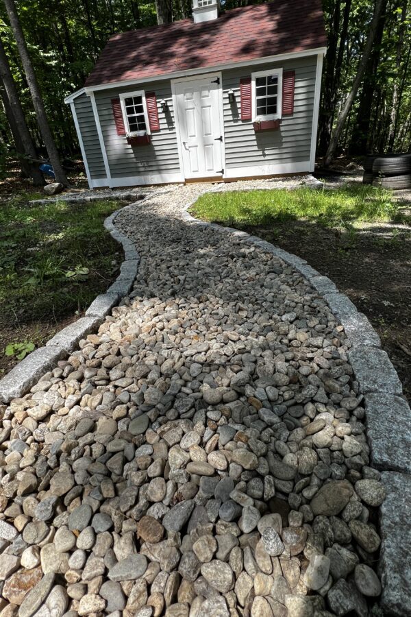 natural stone pathway with cobblestone border
