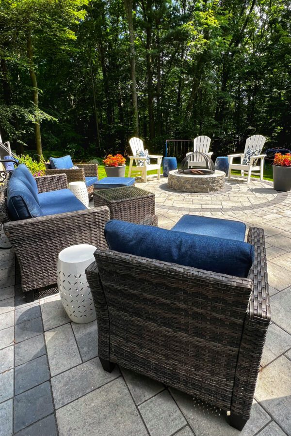 back yard landscape design with paver patio and fire pit
