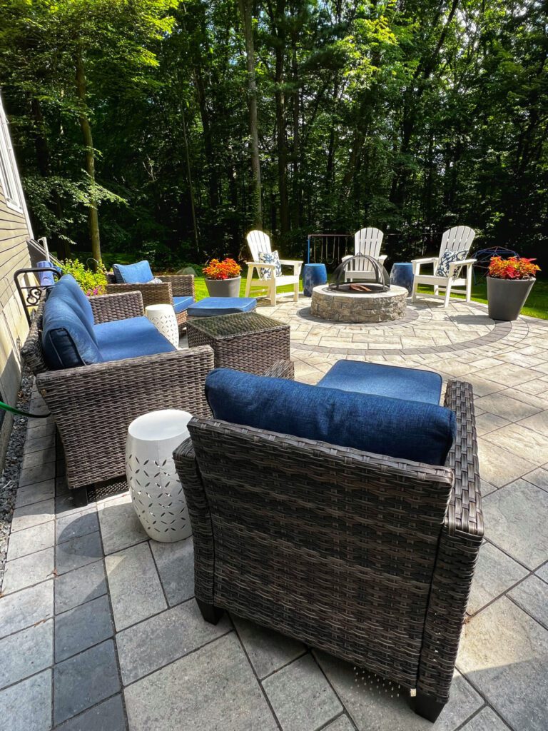 back yard landscape design with paver patio and fire pit