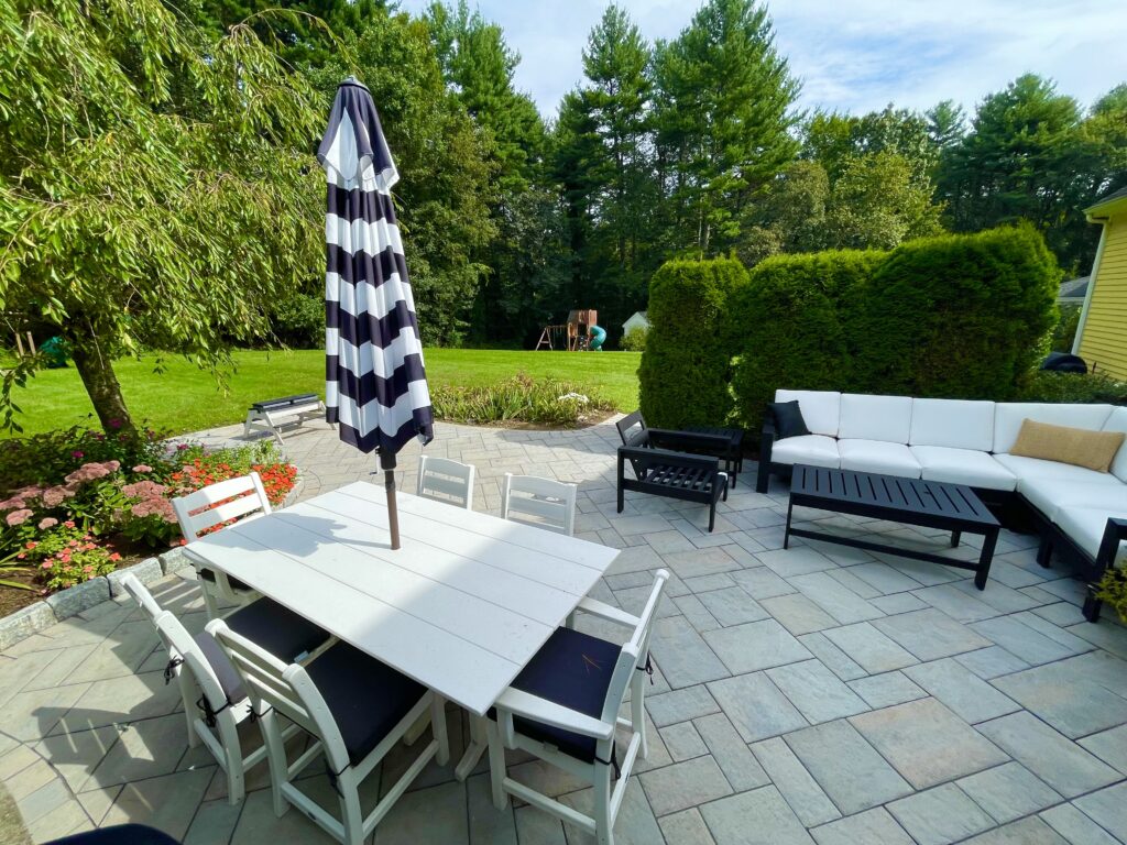 paver backyard patio with fire pit and granite steps