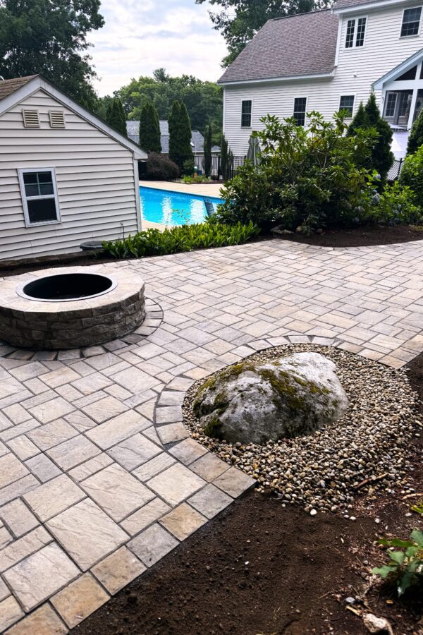 backyard paver patio with fire pit