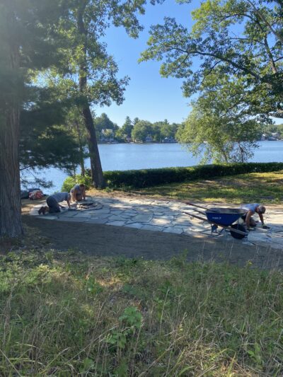 working on back yard bluestone patio by lake