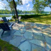 after picture of beautiful bluestone patio by lake in Chelmsford MA