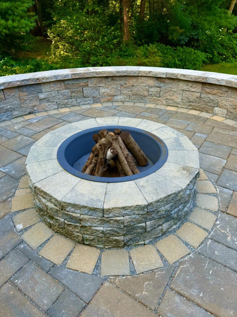 back yard fire pit for toasting marshmellows and paver patio with sitting wall