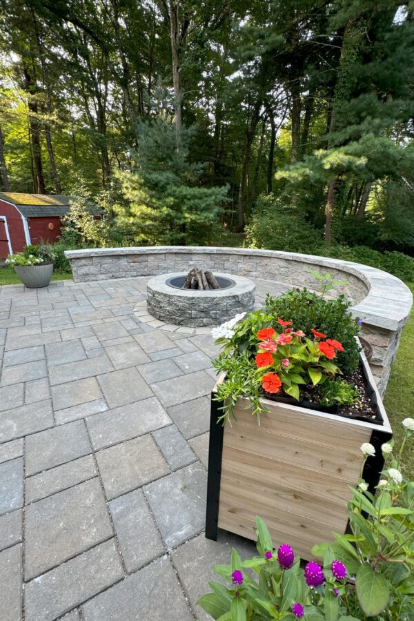 paver patio with modular block fire pit and sitting wall