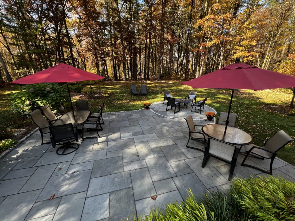 outdoor paver patio with fire pit and furniture