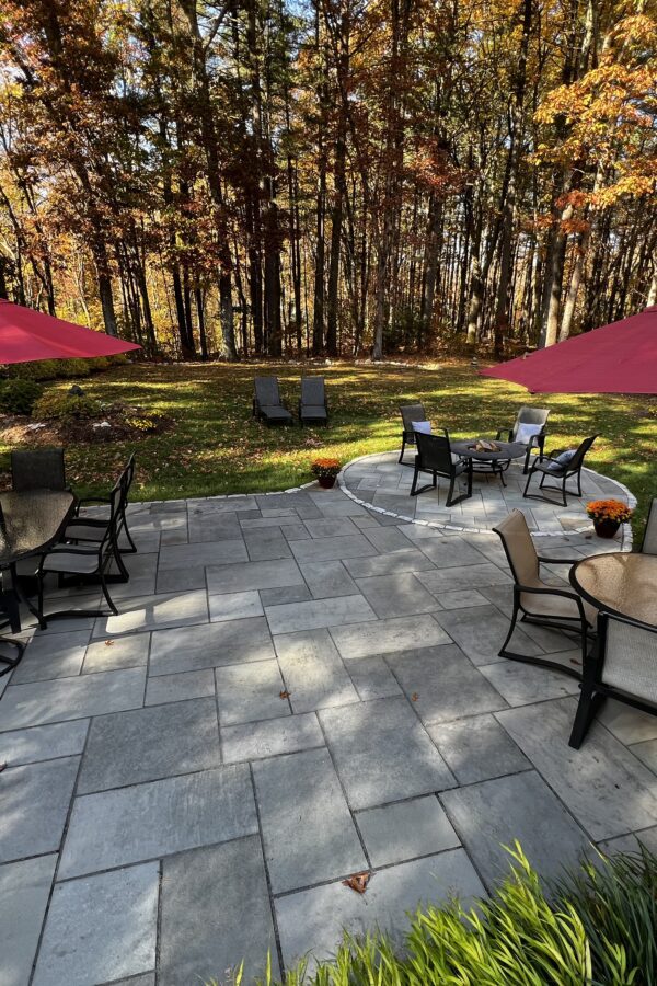 outdoor paver patio with fire pit and furniture