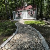 natural stone walkway with granite cobble border